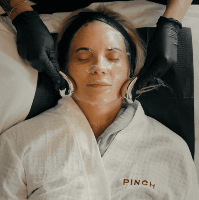 Woman laying down with face mask.
